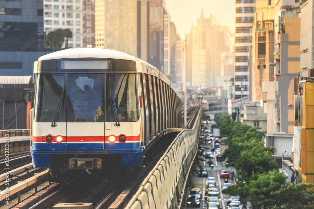 Naklejka premium BTS Sky Train is running in downtown of Bangkok. Sky train is fastest transport mode in Bangkok