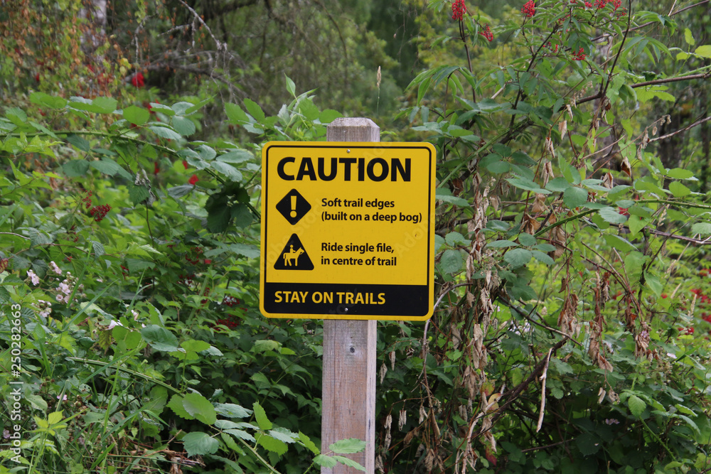 A sign warning about the condition of the trails