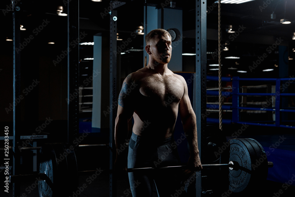 Strong man working in gym Strong man working in gym