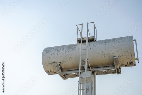 Water tank cement with white sky