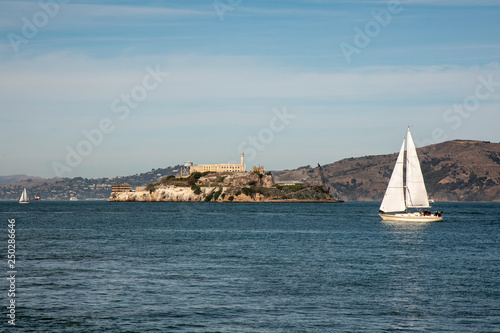 sailboat sailing in the bay of san francisco with alcatraz island in the background