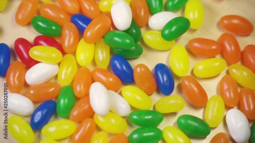 Jelly beans fallin over a jelly bean pile in slow motion from an original 120 fps. Jelly beans fallin over a jelly bean pile in slow motion from an original 120 fps.