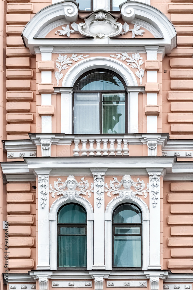 Three Windows on a pink wall.