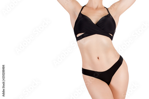 Female sexy fit cropped body in black sporty bikini, isolated on white