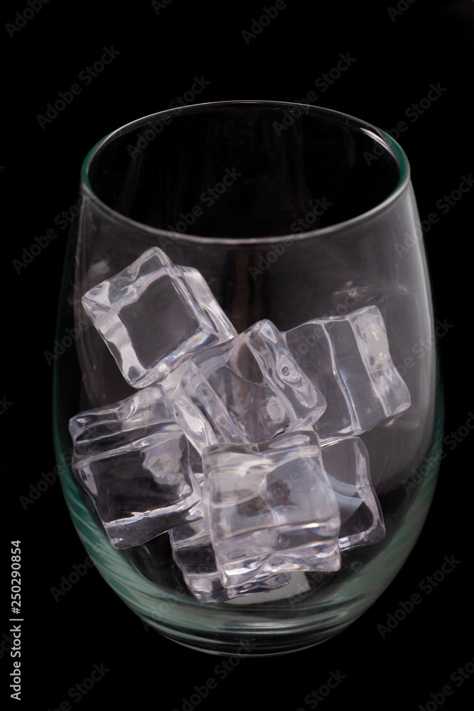 glass with ice on black background glass with ice on black background