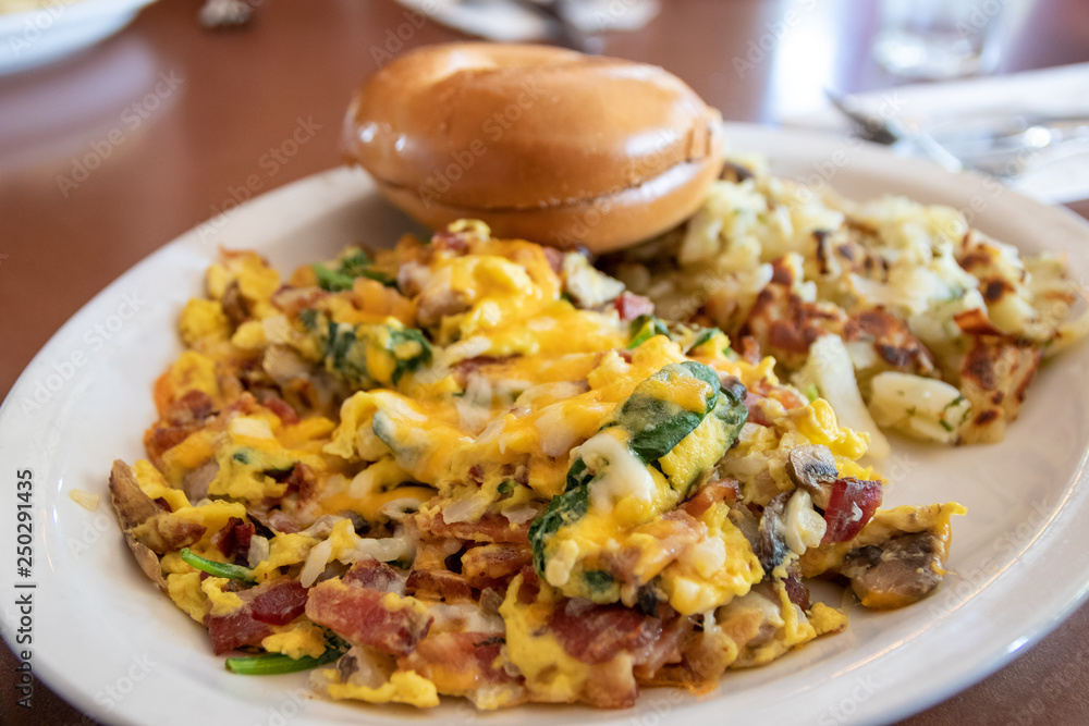 Scrambled Eggs with bacon, spinach and bagel