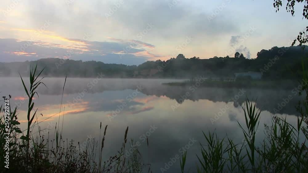 Lake during early morning with fog Lake during early morning with fog