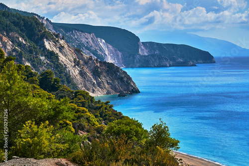 Pine trees on a cliff above the sea on the Greek island of Lefkada.