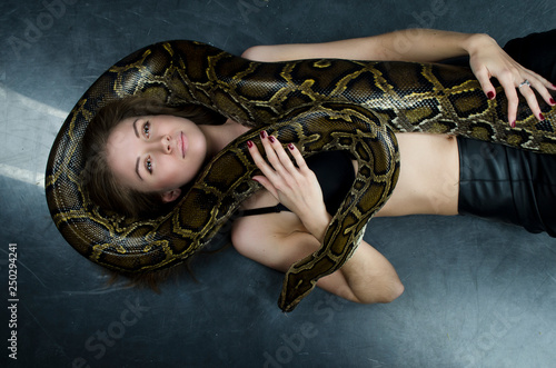 sensual girl and python in studio