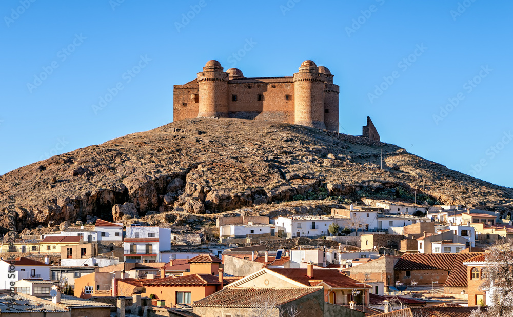 View of historic La Calahorra castle and town in Granada province, Spain.