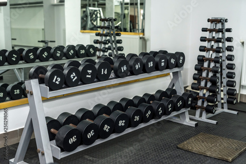 Set of dumbbells in sport gym, equipment