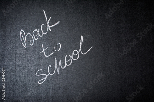 Lettering back to school on black chalkboard