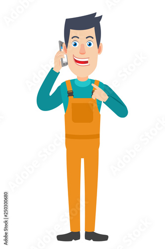 Worker pointing his finger at the mobile phone that he talks