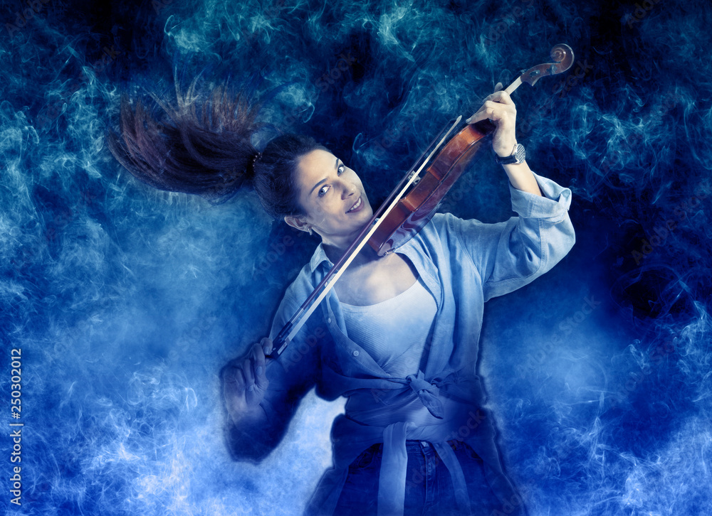 Fototapeta premium Woman playing violin