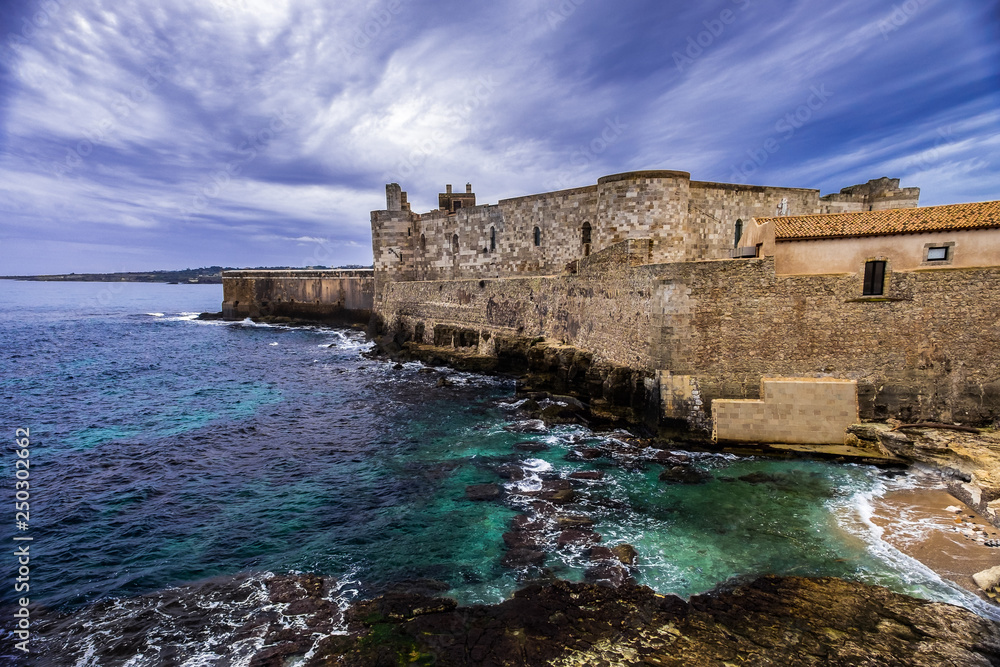 Middle Aged Maniace Castle on seacoast in island of Ortigia on Sicily, Siracusa.