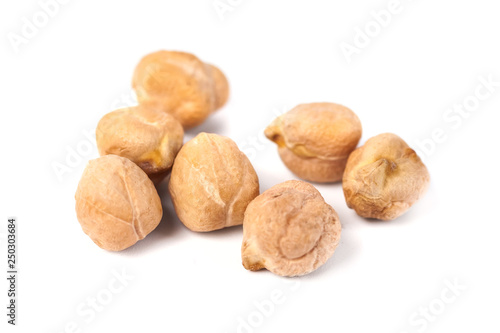 Dry raw organic chickpeas isolated on white background