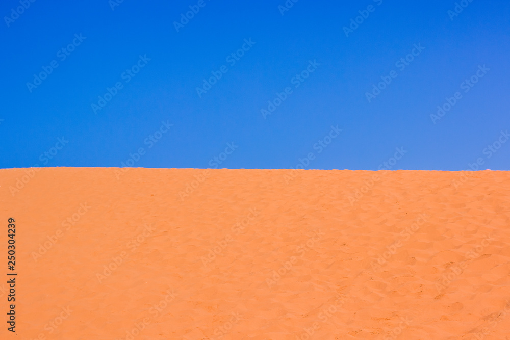idyllic picturesque vivid colorful simple landscape of Sahara desert with  bright yellow sand dunes and empty blue sky, wallpaper pattern background  photography concept with empty copy space for text Stock Photo |