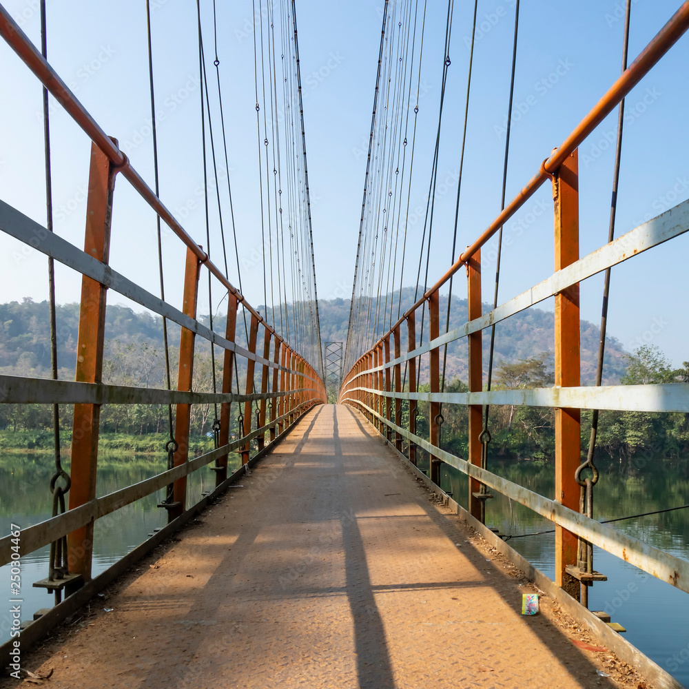 The Inchathotty Hanging Bridge crosses the Periyar River allowing access to the Inchathotty village. Thattekad, Kerala, India