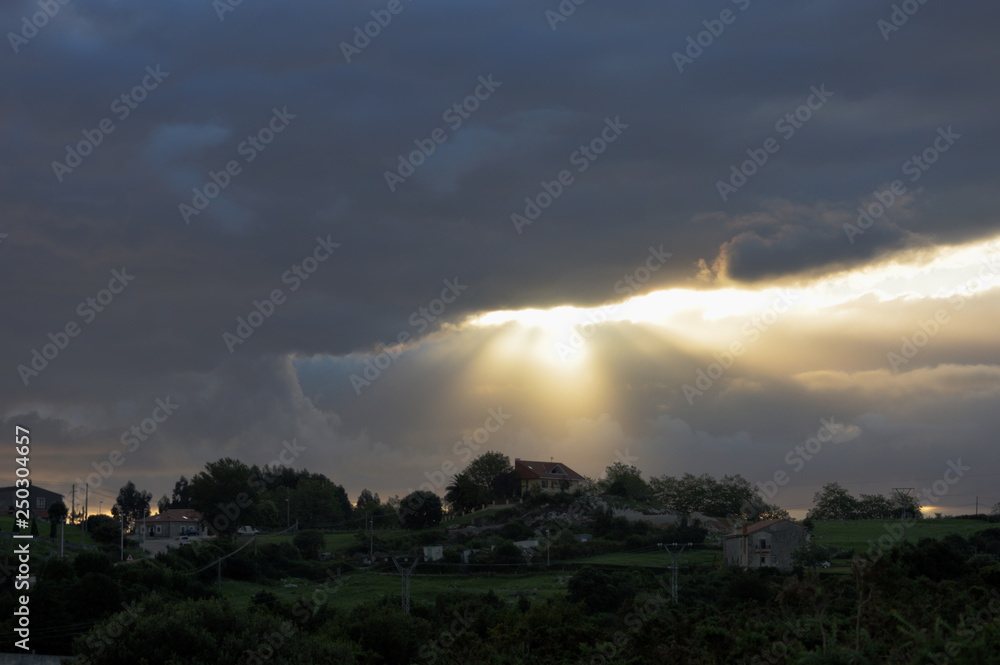 Dark clouds and bright lights over Ruiloba, Cantabria	