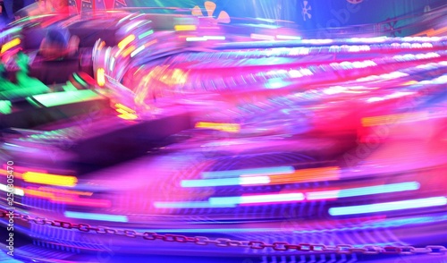 disco lights synthwave neon fairground ride night lights funfair light trails, slow shutter-speed long exposure illuminations futuristic sci fi stock, photo, photograph, picture, image photo