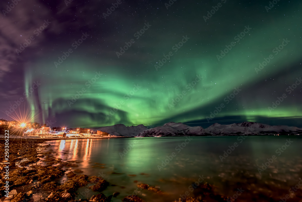Amazing aurora borealis - northern lights - view from coast in Vagnes, near Tromso city -  north Norway