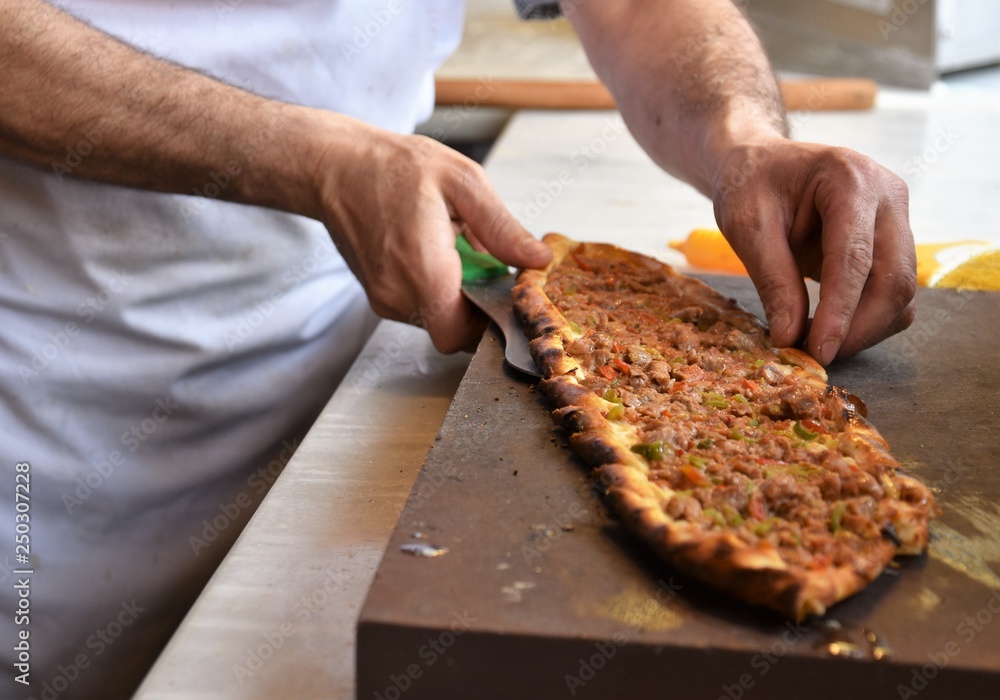 A type of flatbread Turkish pide is being served