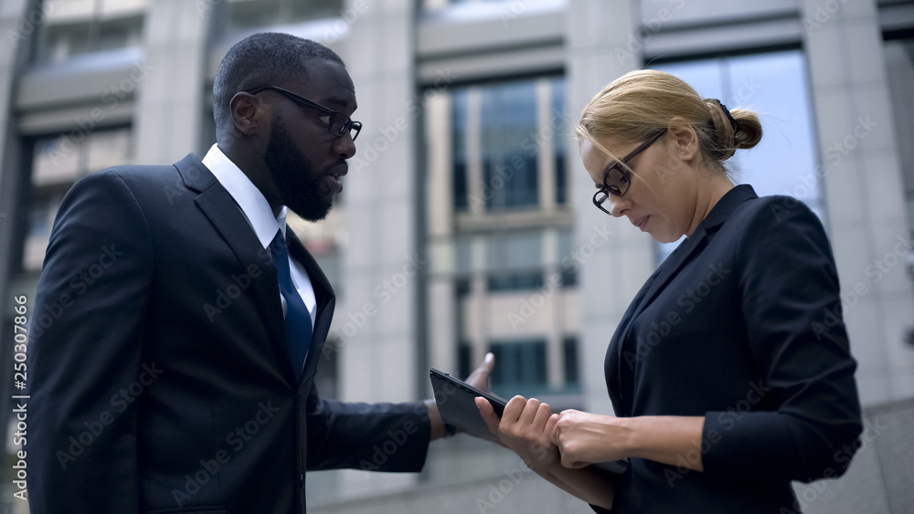 Boss scolds secretary for mistake in annual report, woman under pressure at work Boss scolds secretary for mistake in annual report, woman under pressure at work