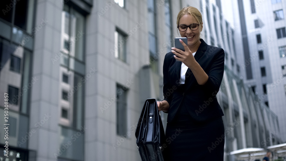 Business lady excited about good news from phone, successful deal, promotion Business lady excited about good news from phone, successful deal, promotion