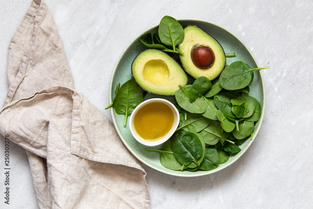 spinach and avocado. Vegetarian concept with copy space spinach and avocado. Vegetarian concept with copy space