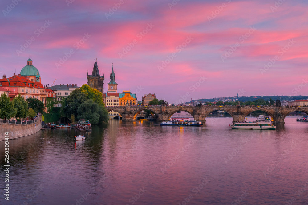 Amazing purple sunset over Charles bridge in Prague, Czech republic
