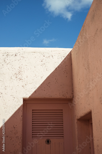 pink wall   shadow and blue sky
