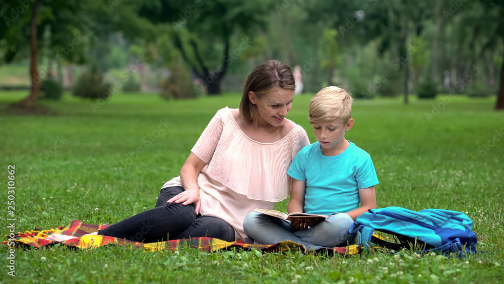 Teacher providing additional classes for junior pupil, individual tutoring Teacher providing additional classes for junior pupil, individual tutoring