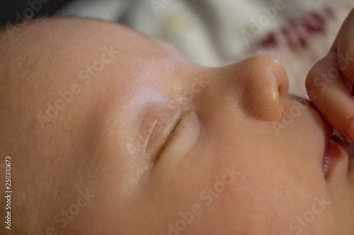 the face of a newborn girl close-up