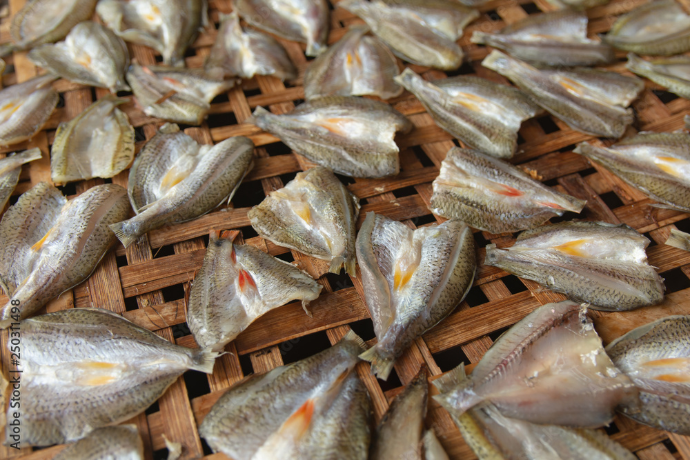 Dried fish on Bamboo sieve with sunny