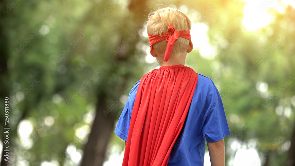 Back view of boy in superman costume, dreamy child, recreational activity  Stock Photo | Adobe Stock