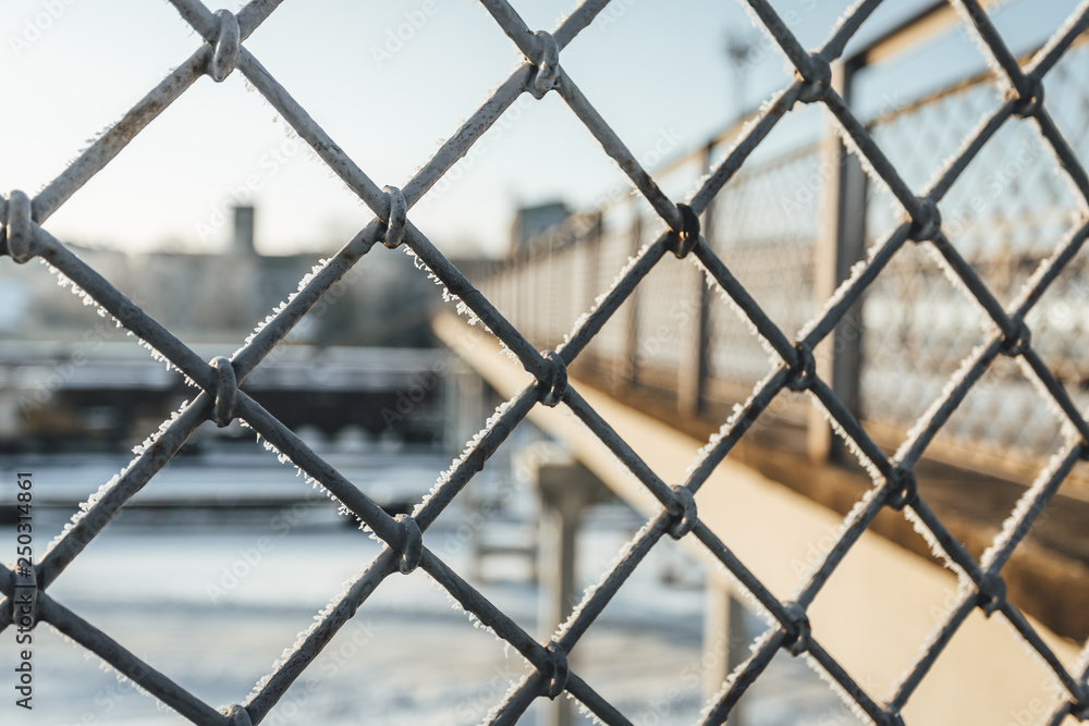 Chain link fence with barbed wire, background texture. Chain link fence with barbed wire, background texture.