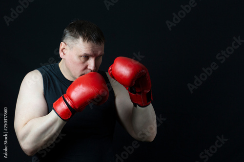 young man with boxing gloves © Александр Поташев
