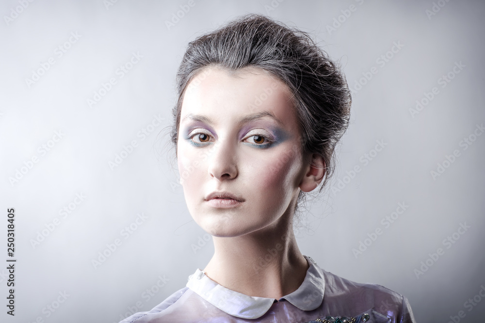 portrait of stylish young woman with day makeup.