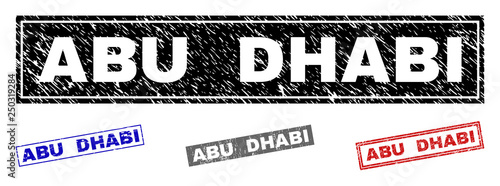 Grunge ABU DHABI rectangle stamp seals isolated on a white background. Rectangular seals with grunge texture in red, blue, black and grey colors.