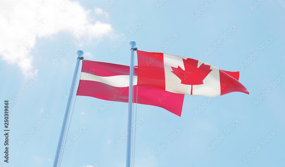 Latvia and Canada, two flags waving against blue sky. 3d image