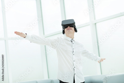 young men testing virtual reality glasses in office