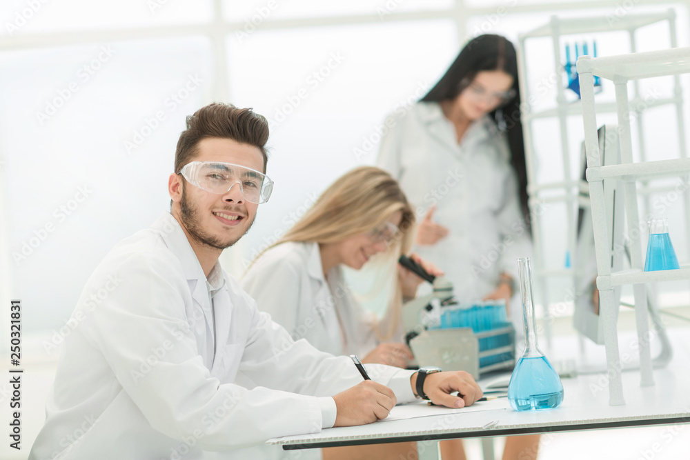 close up.the scientist writes data to the log.