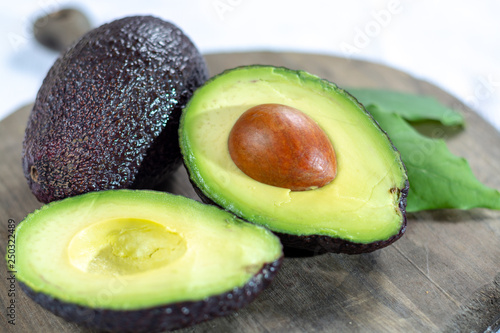 Two ripe raw hass avocados close up