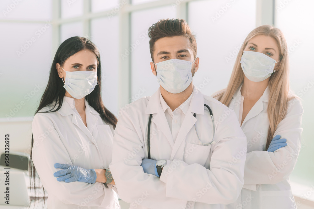 group of surgeons standing together in a medical center group of surgeons standing together in a medical center