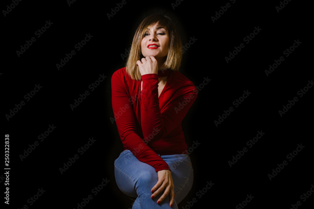 blonde woman posing on black background blonde woman posing on black background