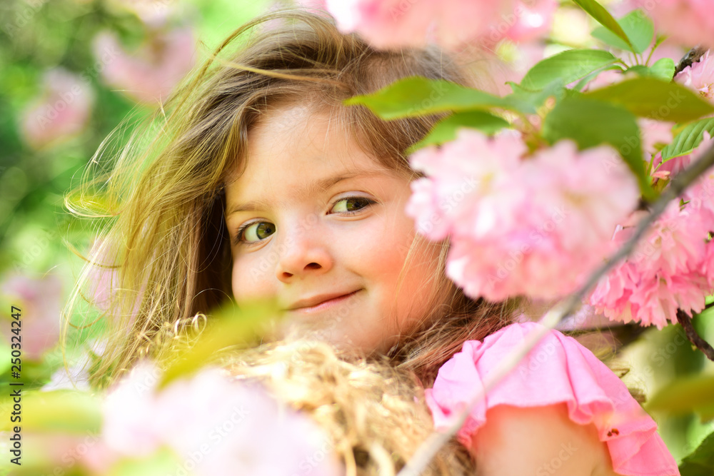Fototapeta premium Good-looking gardener. Summer girl fashion. Happy childhood. Little girl in sunny spring. Small child. Natural beauty. Childrens day. Springtime. weather forecast. face skincare. allergy to flowers