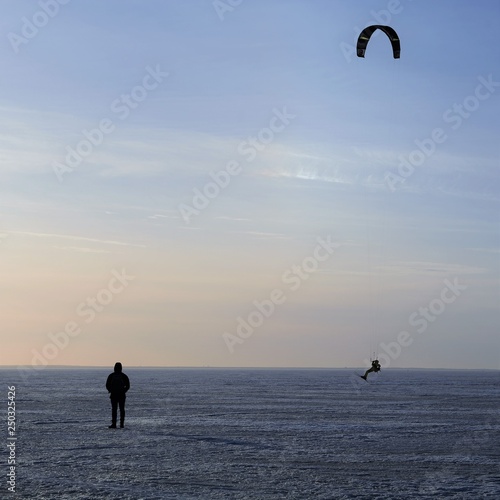 paragliding over frozen gulf