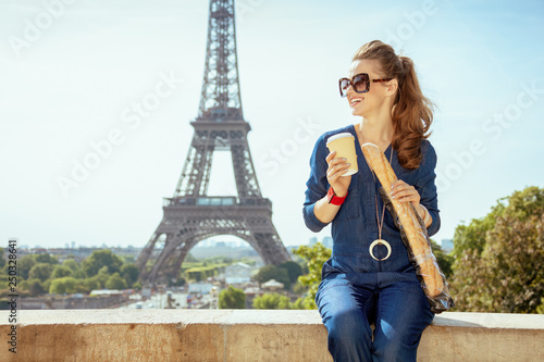 traveller woman with coffee cup and baguette in Paris, France © Alliance