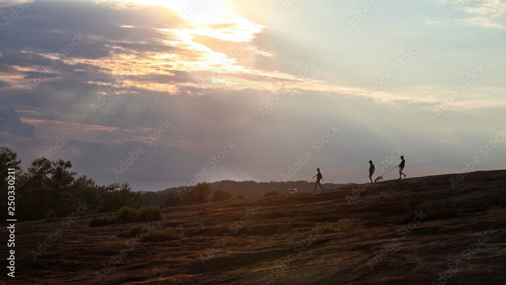 Hiker silhouettes on a mountain. Hiker silhouettes on a mountain.