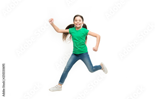 Fototapeta Naklejka Na Ścianę i Meble -  Freedom in moving. Small child wearing casual fashion style. Little fashionista. Fashionable girl child. Little girl with long brunette hair. Small fashion model with beauty look. Carefree cutie